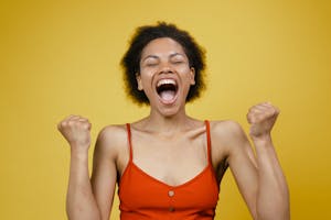 A person smiling in a bright, uplifting setting, symbolizing optimism and positive thinking.