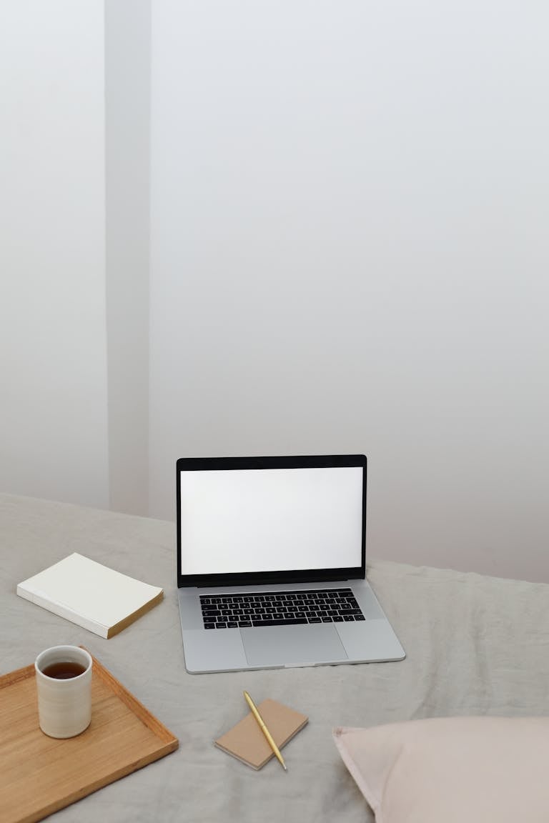 A desk with multiple open devices and tabs, contrasted by a minimalist, distraction-free workspace.