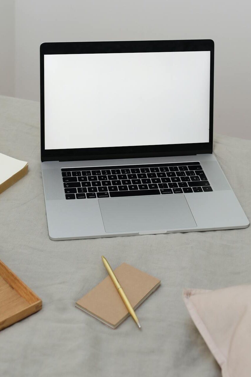 A desk with multiple open devices and tabs, contrasted by a minimalist, distraction-free workspace.