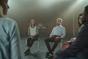A person engaging in a heartfelt conversation, with a calm and understanding expression, conveying a sense of connection.