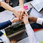A group of professionals connecting at a networking event or shaking hands in a business setting