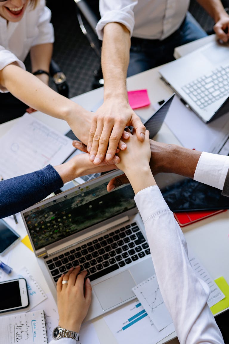 A group of professionals connecting at a networking event or shaking hands in a business setting