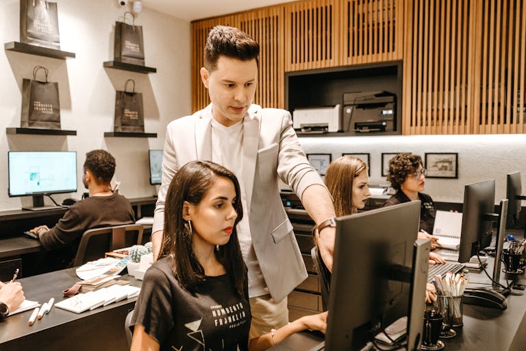 An office worker juggling multiple tasks with a calm expression, showing focus amidst chaos.