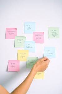 A planner with different colored blocks showing time slots for various tasks.