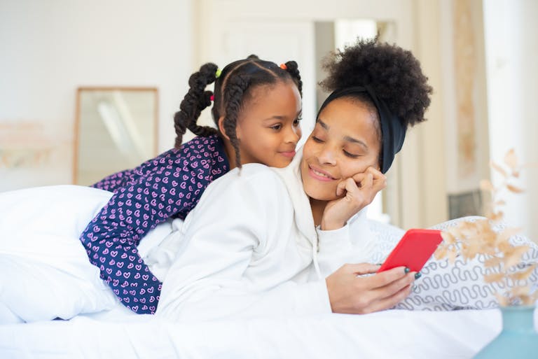 A person gently putting their phone down while enjoying a conversation with family