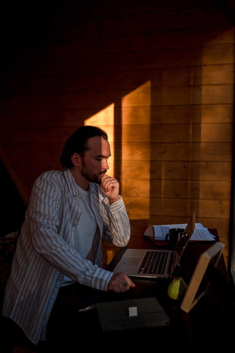 A person working in a quiet environment, deeply focused on a task, with no distractions.