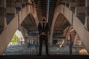 A person standing confidently amidst a chaotic cityscape, symbolizing inner strength amid external stress.