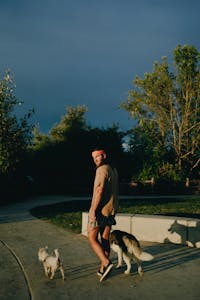 A person putting down their phone and walking outside in nature