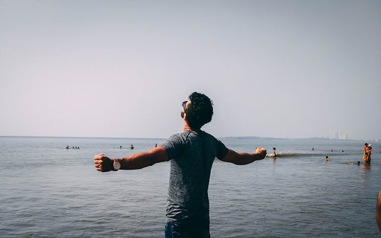 A person enjoying a peaceful, tech-free moment outdoors, free from distractions.