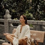 A person meditating or journaling with a peaceful background