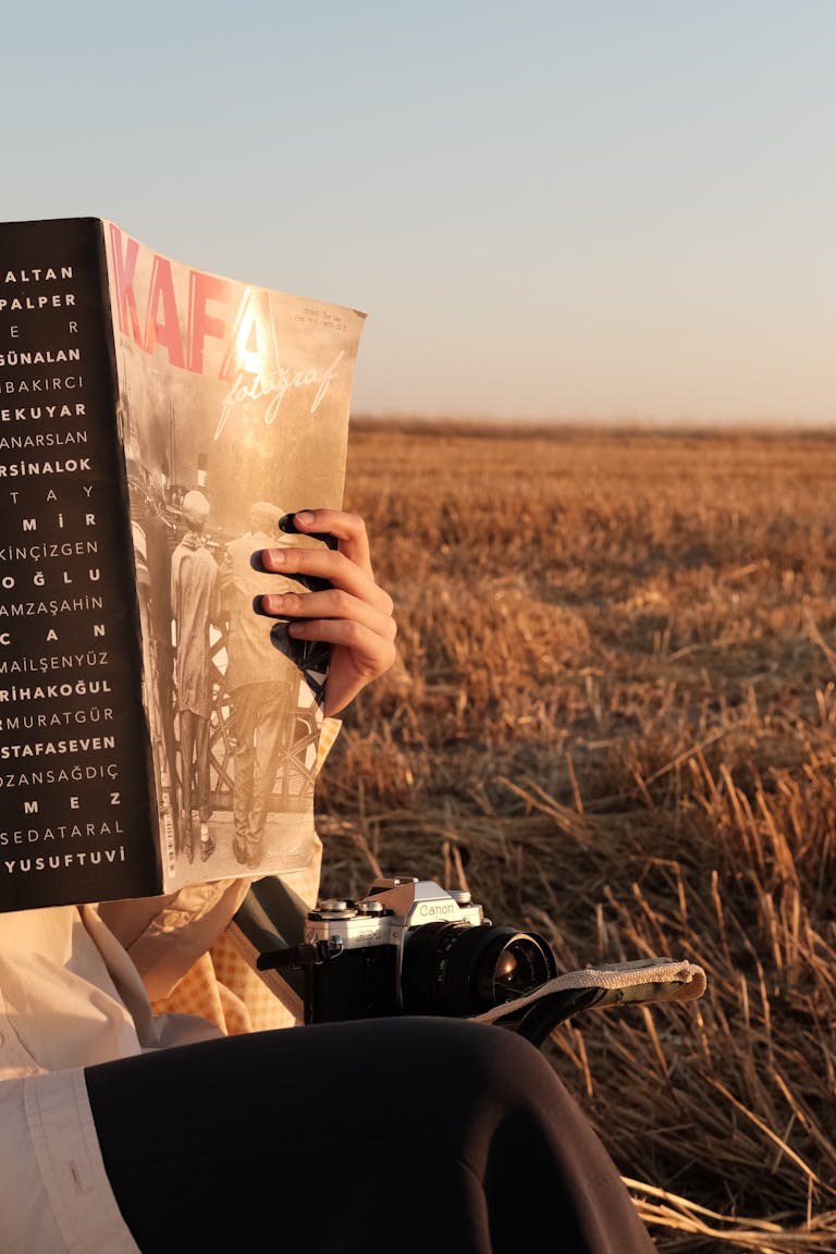 A person holding a gratitude journal or a scene of someone practicing gratitude during sunrise