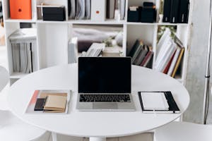 A tidy workspace with a notebook, coffee, and no digital distractions