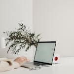 A minimalist workspace with a clean laptop screen and no digital notifications.