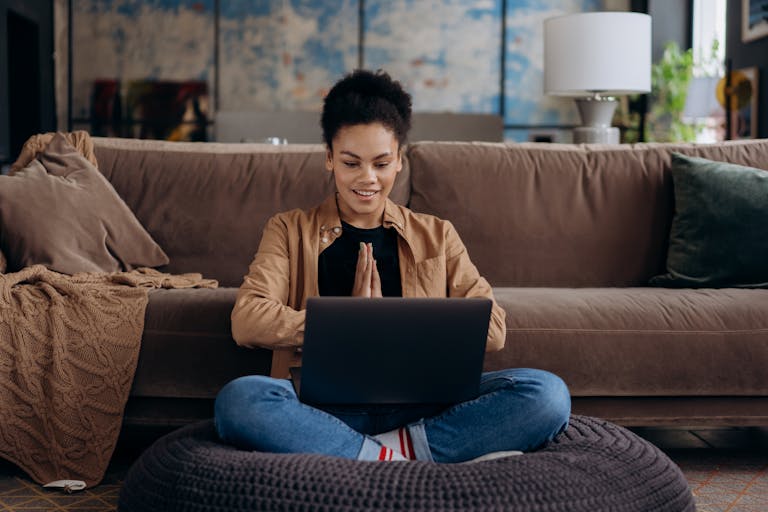A person working from home with a clear boundary between work and personal life, possibly using a laptop, with a balanced workspace featuring elements of relaxation and productivity.