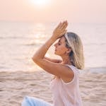 Sunrise with a person meditating or journaling