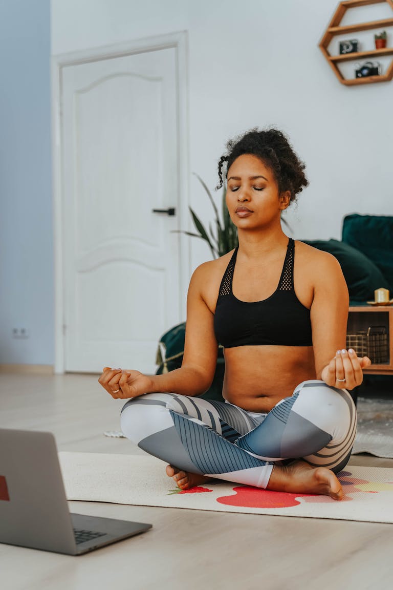 A person meditating with a smartphone turned off beside them, symbolizing balance between digital and mental wellness.