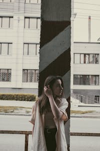 A person standing at a crossroads with arrows pointing in different directions, looking thoughtful but composed.