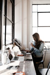 Person peacefully working on a laptop with a calm, uncluttered desk