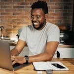 A person working on their personal brand, like updating their LinkedIn profile, or a professional with a strong online presence.