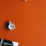 A clock morphing into a checkmark, symbolizing time conquered