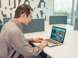 A person updating their LinkedIn profile on a laptop or a professional headshot.