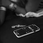 A phone timer counting down from 2 minutes on a tidy desk.