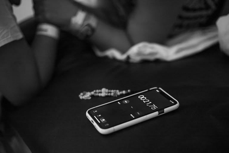 A phone timer counting down from 2 minutes on a tidy desk.