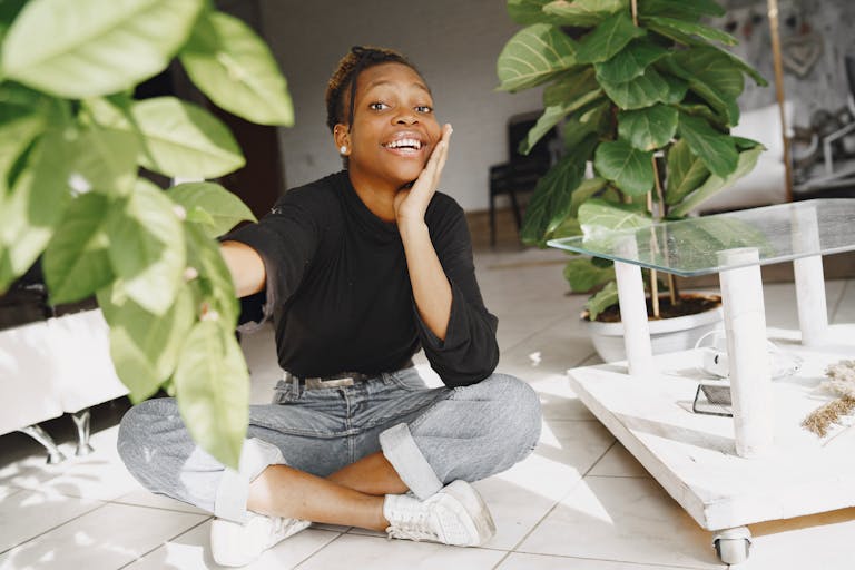 A person turning off multiple devices with a peaceful expression, surrounded by nature or a clean desk space.
