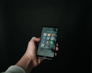 Someone turning off social media notifications on their phone.