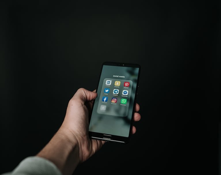 Someone turning off social media notifications on their phone.