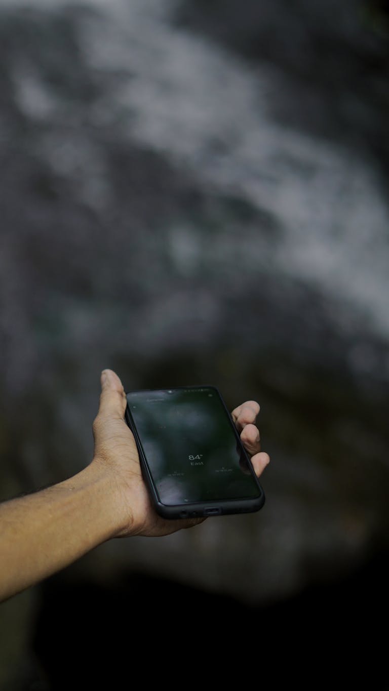 A person turning off their devices with a calm outdoor background or a serene minimalist workspace