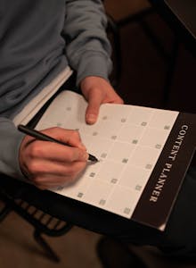 A calendar, clock, and to-do list to symbolize effective time management techniques, with a person organizing tasks for the day.