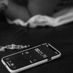A phone timer counting down from 2 minutes on a tidy desk.