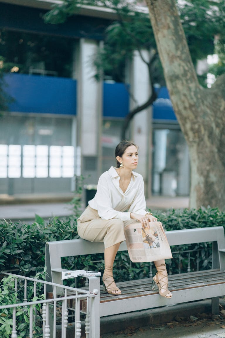 A person sitting peacefully in nature, phone turned off, enjoying the moment.