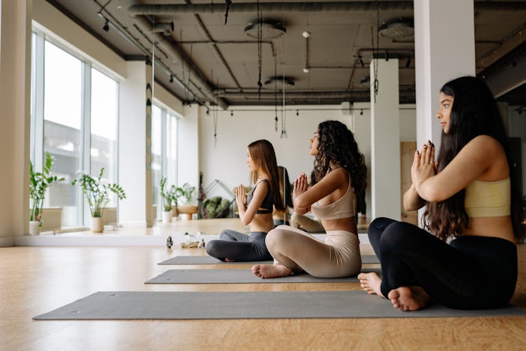 A calm person meditating in the middle of a chaotic or busy environment