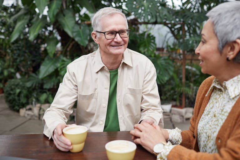A person enjoying coffee while planning their day at sunrise