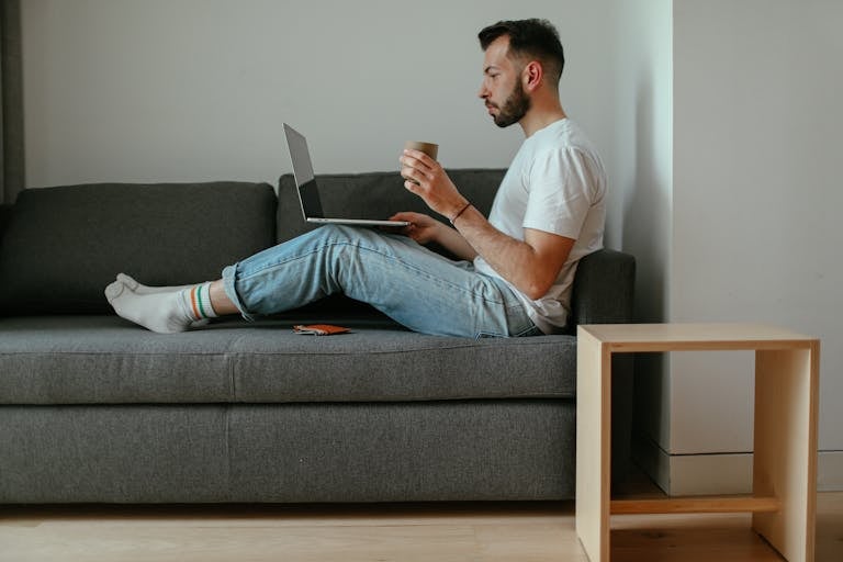 A split-screen image showing someone working on a laptop on one side and relaxing on the other.