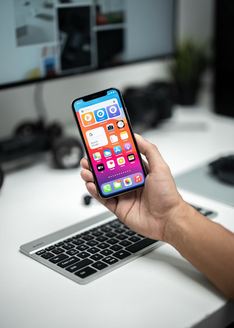 A minimalist smartphone screen with only essential apps, set on a clean desk.