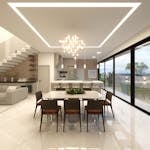 Sleek contemporary interior design featuring an open-plan kitchen and dining area with elegant lighting.