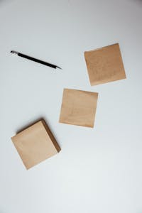 A minimalist desk with a notepad labeled “Top 3 Priorities,” surrounded by calm, uncluttered space.
