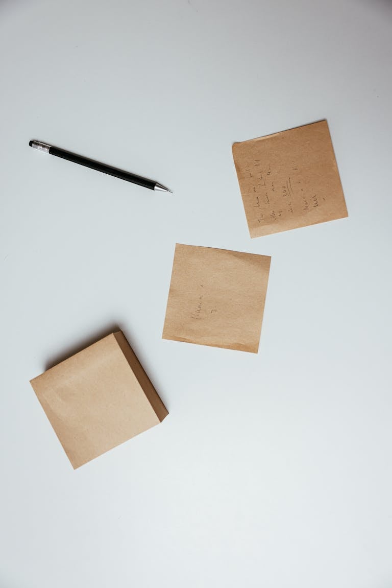 A minimalist desk with a notepad labeled “Top 3 Priorities,” surrounded by calm, uncluttered space.