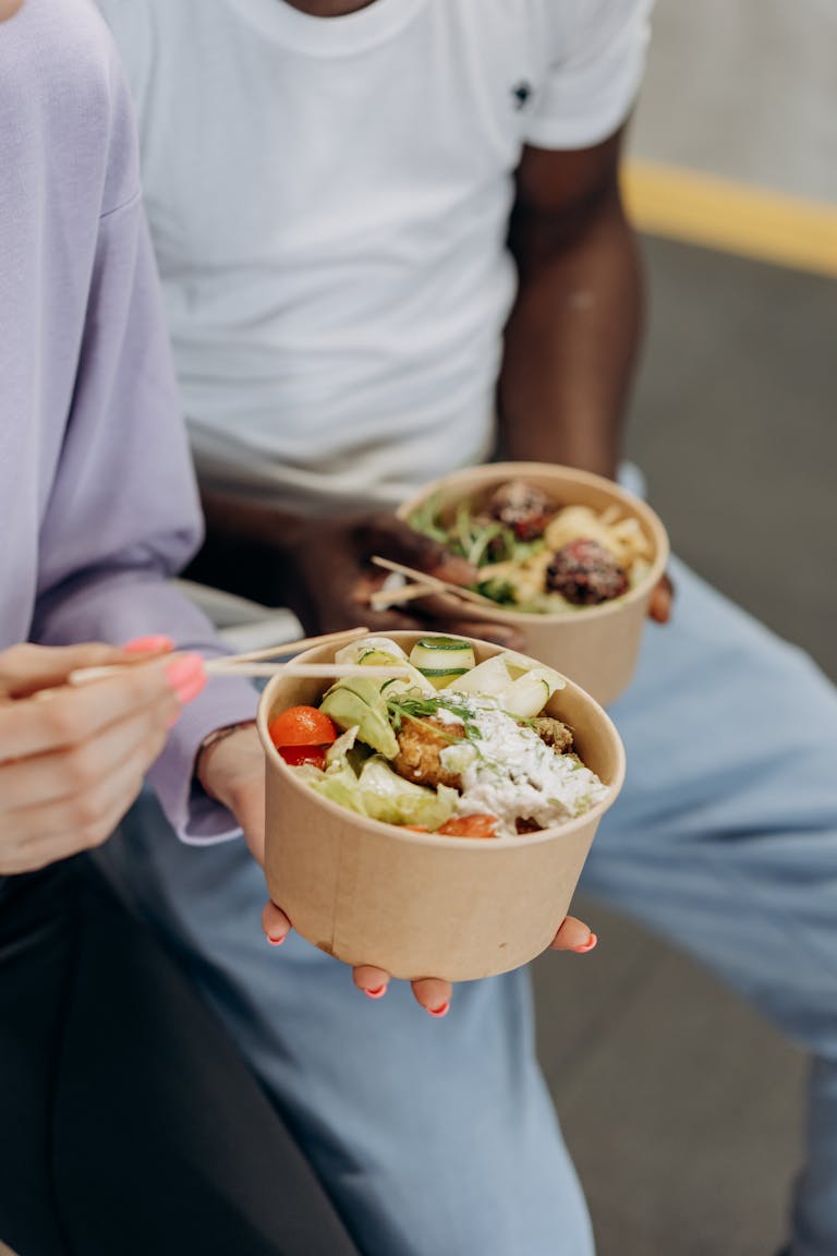 A split-screen showing a person choosing between junk food and a salad.