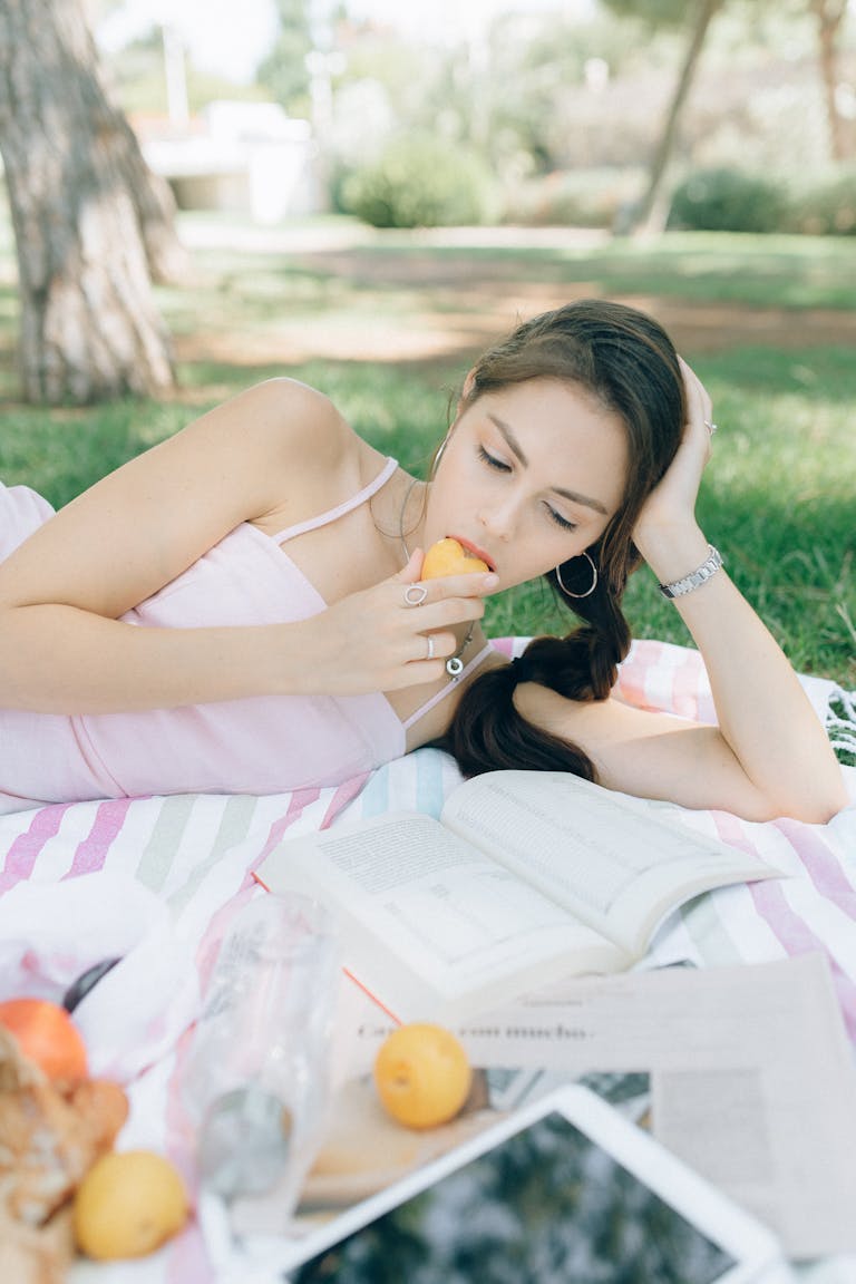 A person taking a break from their phone, enjoying nature or a book