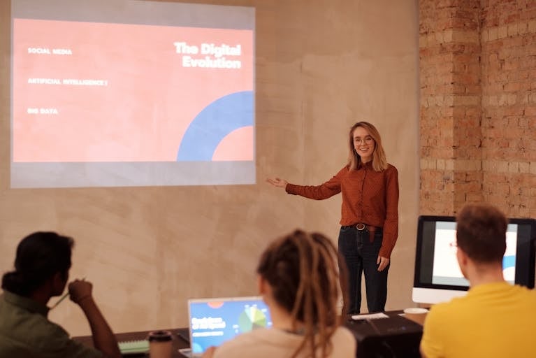 A person confidently presenting in front of an audience or sharing a story on social media with a professional but approachable demeanor.